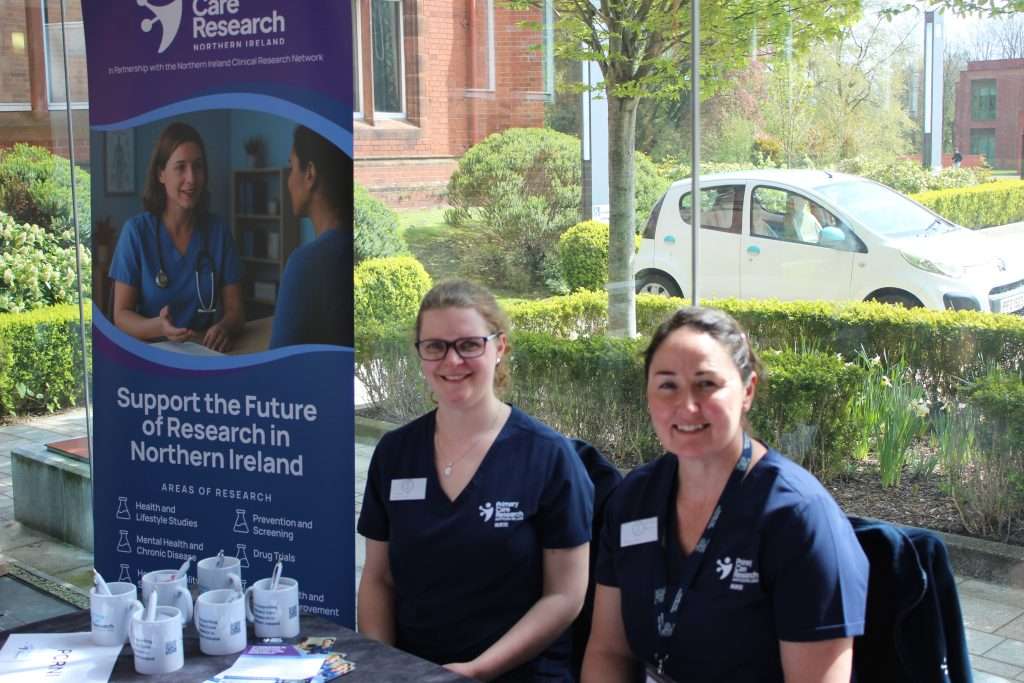 Image of research nurse staff in front of PCRNI banner