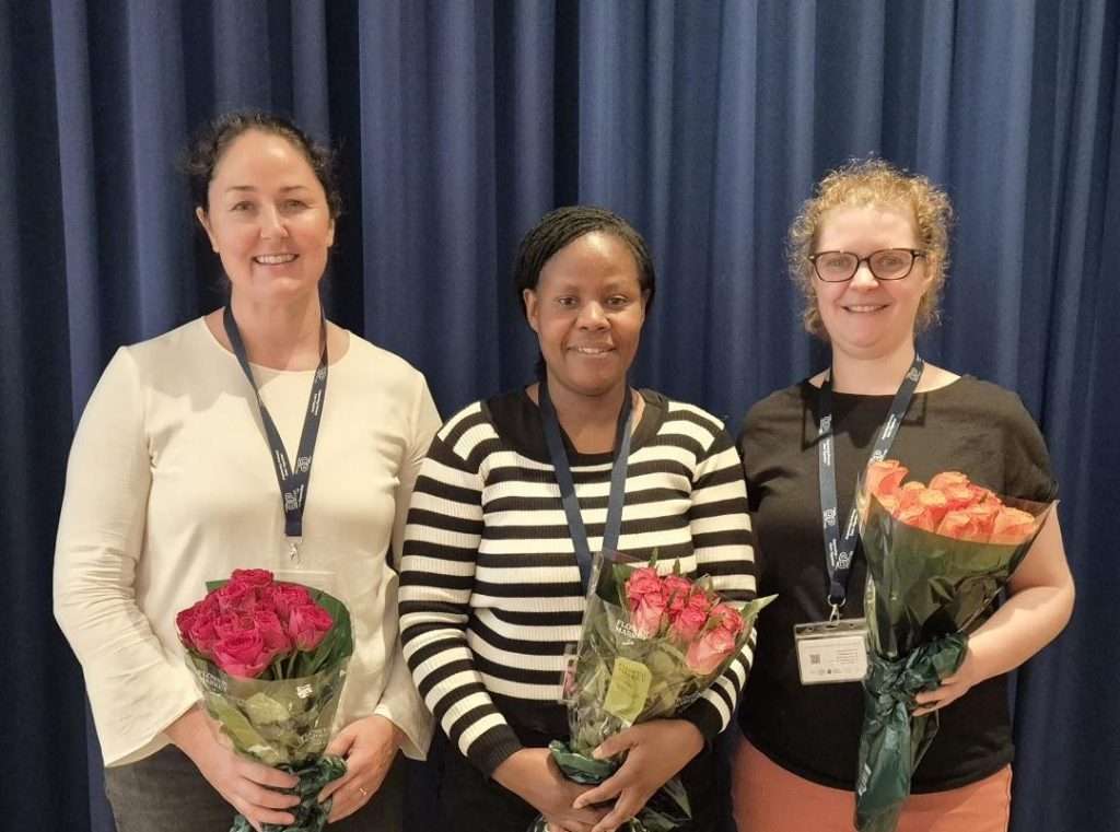 Research Nurses Érin, Marian and Kirsten holding bunches of Roses